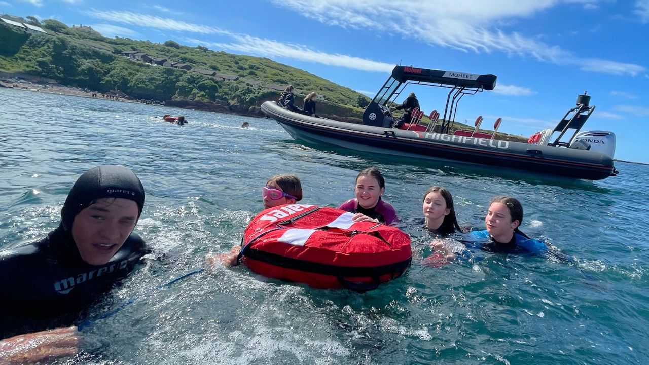 Family taster session beside the RIB